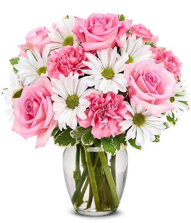 Floral arrangement featuring pink roses, white daisies, and pink carnations, optionally in a vase.