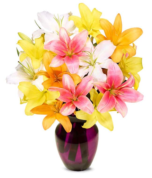 A vibrant floral arrangement featuring pink lilies, orange lilies, and yellow lilies.